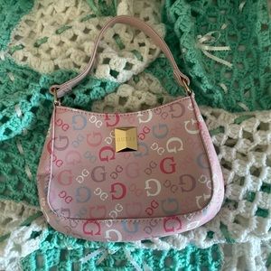 Brand new Guess mini hand purse with crossbody gold strap included